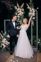 Happy wedding photography of bride and groom at wedding ceremony.