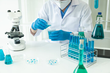 Fototapeta premium Medical Research Laboratory. Male scientist analyzing advanced science data for medical biotechnology development of microbiology laboratory researchers wearing gloves close-up image