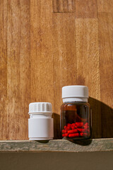 a white plastic painkiller bottle on a shelf