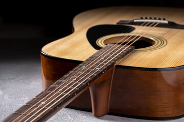 Classical guitar close up. Acoustic guitar on wood background.Music instrument concept