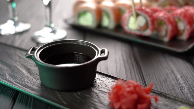 Sushi Set. Sushi roll with shrimp dipped in soy sauce