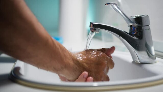 Doctor washes his hands before surgery