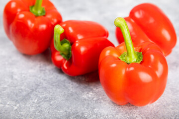 PAPRIKA.Fresh whole red bell pepper on a light textured background. Bulgarian salad pepper .Fresh vegetables. Harvest. Vegan. close up