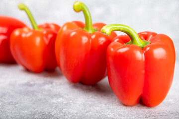 PAPRIKA.Fresh whole red bell pepper on a light textured background. Bulgarian salad pepper .Fresh vegetables. Harvest. Vegan. close up