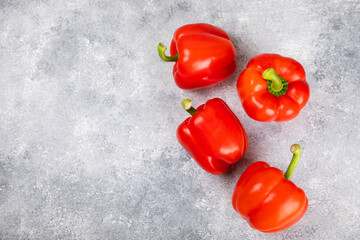 PAPRIKA.Fresh whole red bell pepper on a light textured background. Bulgarian salad pepper .Fresh vegetables. Harvest. Vegan. close up