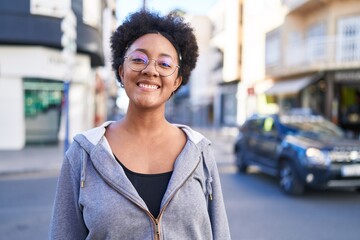 African american woman smiling confident standing at street