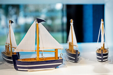 ship models with sailboats on a blue background