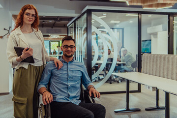 Young business colleagues, collaborative business colleagues, including a person in a wheelchair,...