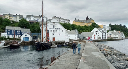 Old port in Alesund, Norway. Olaf Holf warehouse building, Fisheries Museum(fishing industry) in...