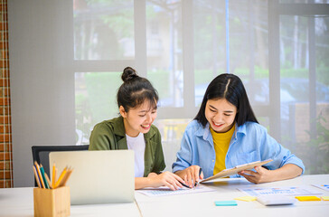 group of business people working and communicating together in the office With the charging of graphs for analysis, conceptual analysis and business planning.