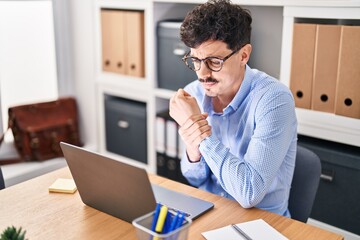 Young caucasian man business worker suffering for wrist pain working at office