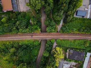 Flat view on railway bridge over tram rails. Crossroads.