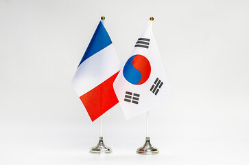 State flags of France and South Korea on a light background.