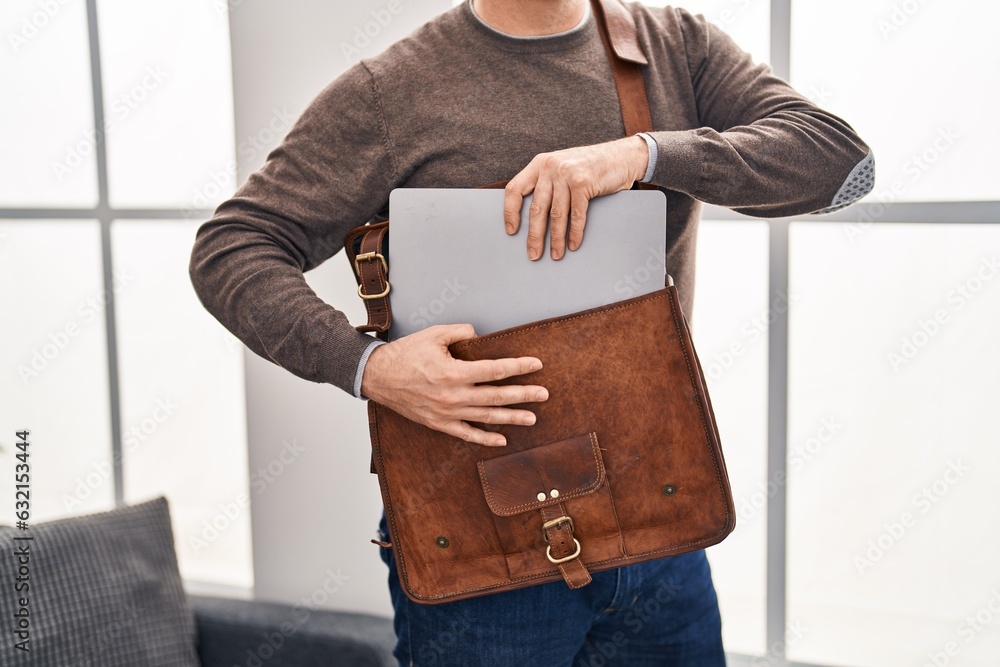 Sticker young caucasian man business worker holding laptop of briefcase at office