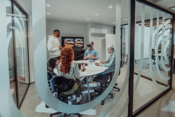 A diverse group of businessmen collaborates and tests a new virtual reality technology, wearing virtual glasses, showcasing innovation and creativity in their futuristic workspace
