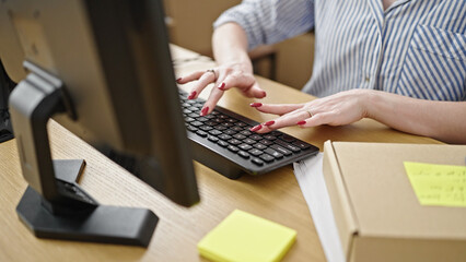 Young blonde woman ecommerce business worker using computer working at office