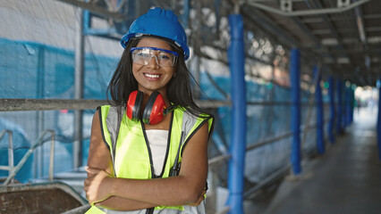 African american woman builder standing with arms crossed gesture saying yes with head at street