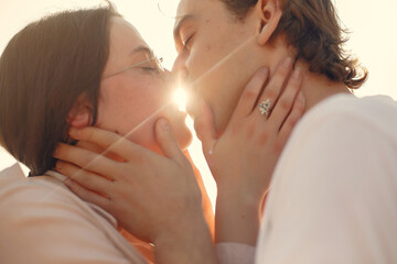 Beautiful couple spend time on a summer forest