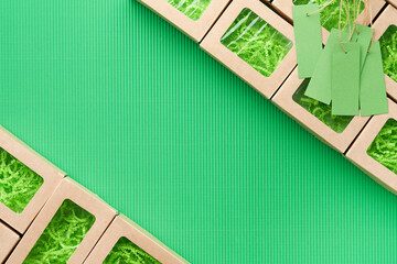 Green Friday backgrounds mock up. Sale Tag on green background. Paper shopping boxes and green tag....