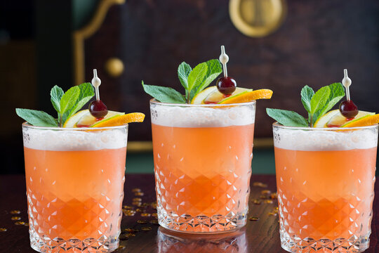 beverage, cocktail, refreshment, bar, food, drink, juice, glass, alcohol, fresh, fruit, ice, garnish, cold, background, syrup, alcoholic, citrus, tropical, wooden, gin, party, refreshing, closeup, red