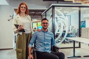 Young business colleagues, collaborative business colleagues, including a person in a wheelchair, walk past a modern glass office corridor, illustrating diversity, teamwork and empowerment in the