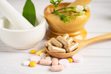 Alternative medicine herbal organic capsule with vitamin E omega 3 fish oil, mineral, drug with herbs leaf natural supplements for healthy good life.