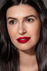 Fototapeta premium Fashion portrait of caucasian young brunette woman with perfect hair styling and fresh healthy skin