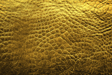 Golden textured surface as background, closeup view