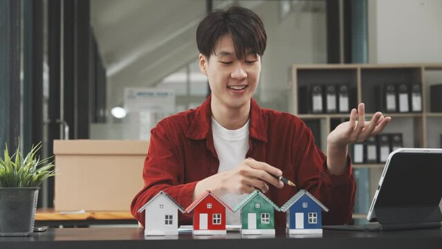Young Korean male realtor suggest How to choose the right real estate agent, Compare real estate agents online. Get referrals Check out the local housing market yourself. Clarify your sales motive.