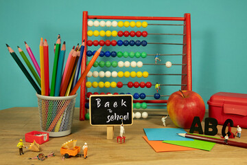 back to school concept with abacus and lunchbox