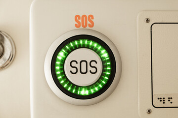 Emergency button with SOS text on the train