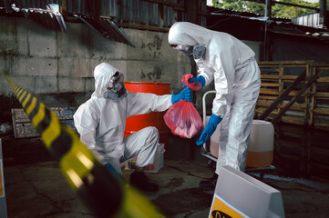 Contain Chemical Spill to Red Garbage Bags After Absorb, Part of Steps for Dealing with Chemical...