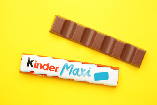Mykolaiv, Ukraine - July 28, 2023: Kinder maxi chocolate on yellow background