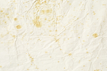 Beige paper with yellow stains