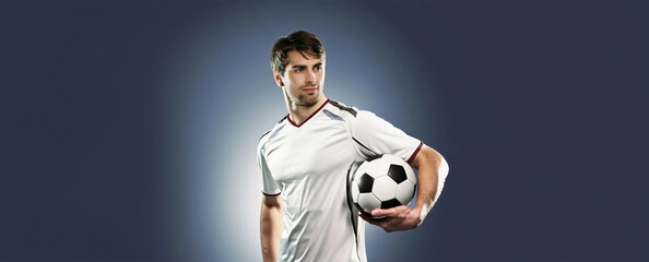 soccer player holding ball