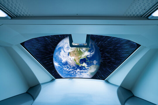Window view of alien spaceship. UFO or unidentified flying objects. Alien invasion. Space travel. Alien spaceship and extraterrestrial technology. Futuristic spacecraft. Earth image provided by Nasa. - Powered by Adobe