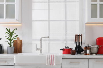 Set of different utensils on countertop in kitchen