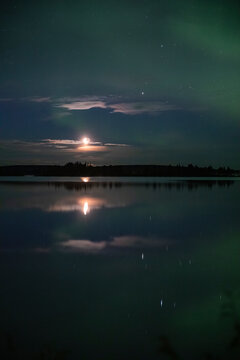 Moonlight and the Gemini constellation over the lake
