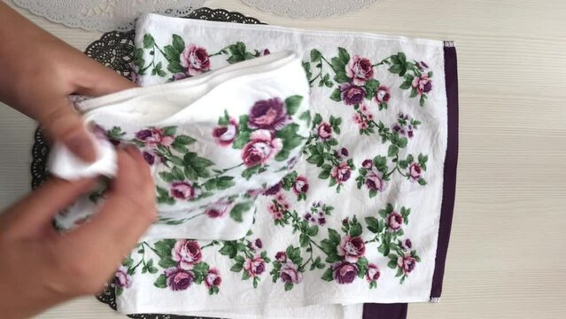The woman makes a brown tange after the purchase. Lays on the table. Close-up. Vertical video