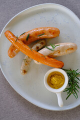 Homemade German Sausage with sauce on dish