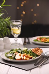 Delicious salad with peach slices served wooden table