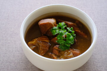 Stewed Pork Thai food. Pork leg stew on rice, or kao ka moo, is the quintessential Thai street food. 