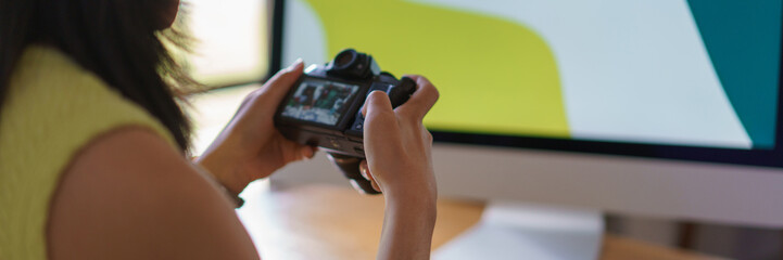 Needlework concept, Women working on computer and checking picture of handicraft on camera