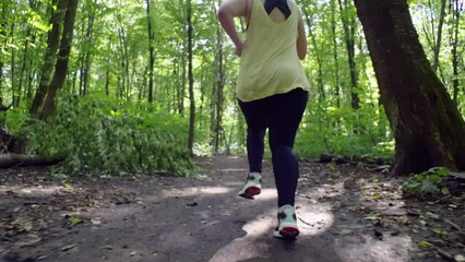 Inspirational Weight Loss Journey: Curvy Girl Embracing Nature's Trail for Fitness and Wellbeing. High quality 4k footage