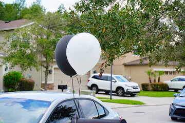 black and white ballon blow in the wind	