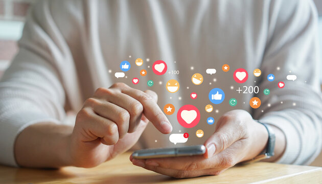 adult man hand hold smartphone and use social media network application to check new feedback or interactive with people or friend by reply chat or send emoticon for  react feeling and moment concept