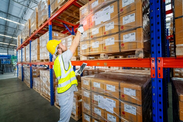 Storehouse workers are checking stock and inventory in retail warehouse. Business factory industry concept.