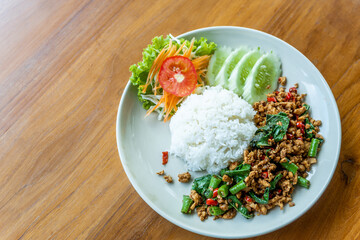 Rice topped with stir-fried chicken and basil