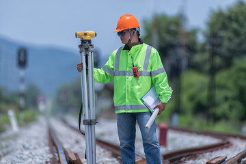 Survey construction worker on Railway site. Worker working on railway.