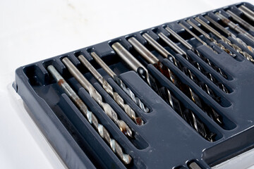 several drill bits on a white background